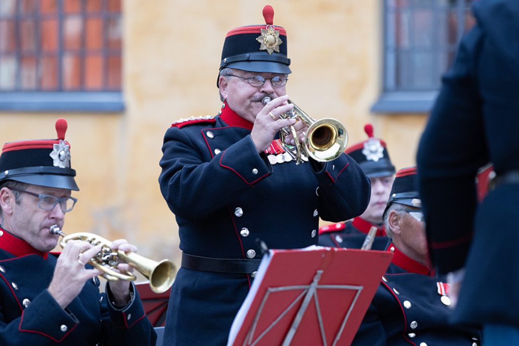 Man playing a wind instrument. Summer concert at Kastellet
